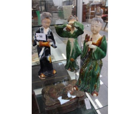A GROUP OF THREE TANG STYLE STANDING FIGURES OF MUSICIANS.