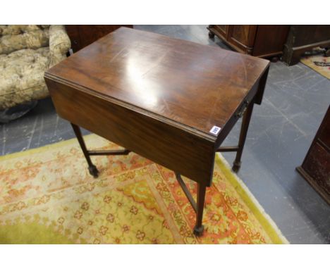 AN 18TH.C.GEORGIAN MAHOGANY PEMBROKE TABLE WITH UNUSUAL DEEP CHAMFERED LEGS UNITED BY SHAPED STRETCHER IN THE MANNER OF THOMA