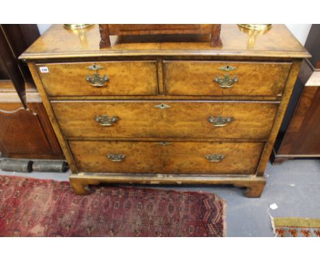 A 19TH.C.WALNUT CHEST OF TWO SHORT AND TWO LONG DRAWERS ON BRACKET FEET