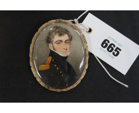 AN EARLY 19TH.C.MINIATURE WATERCOLOUR PORTRAIT OF A YOUNG MAN IN NAVAL UNIFORM, MOUNTED IN AN UNUSUAL YELLOW METAL SWIVEL FRA