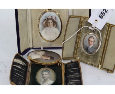 AN EDWARDIAN OVAL PORTRAIT OF A YOUNG MAN IN GOLD ENCLOSED FRAME WITH FITTED LEATHER CASE AND THREE OTHER OVAL PORTRAITS.