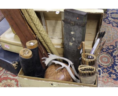 A VINTAGE DOME TOP PINE TRAVELLING TRUNK CONTAINING A MEDICINE BALL, GUN CASE, RIDING BOOTS,ETC