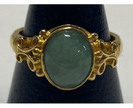 A hallmarked Chinese 22ct gold and Jade stone solitaire ring. 7.36 grams. Size N 1/2. 