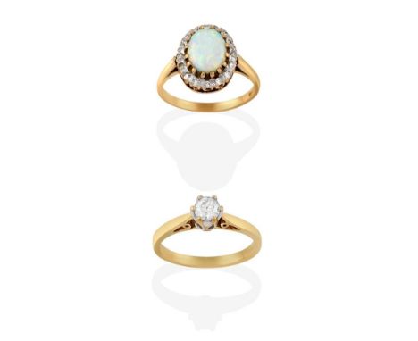 A 9 Carat Gold Opal and Diamond Cluster Ring, the oval cabochon opal in yellow claw settings, within a border of eight cut di