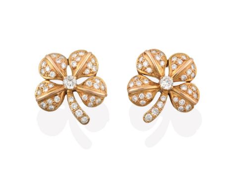 A Pair of Diamond Earrings, realistically modelled as floral motifs, set throughout with round brilliant cut diamonds in yell