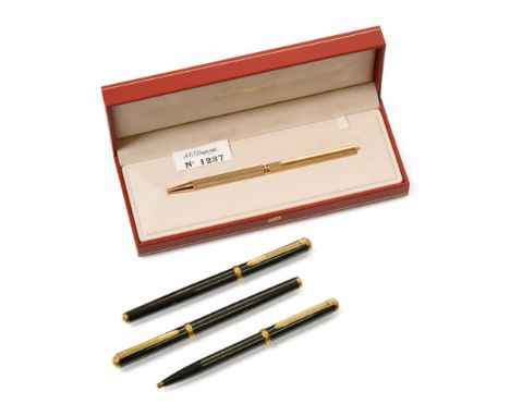 A S. T. Dupont Gilt Ball-Point Pen, with engine turned decoration, in original gilt-tooled red leather case, the case 19.5cm 