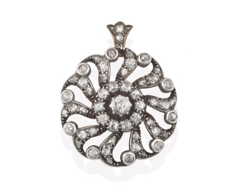 An Early 20th Century Diamond Cluster Pendant, of openwork wheel design, an old cut diamond within a border of smaller old cu