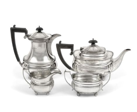 A Four-Piece George V Silver Tea-Service, by Mappin and Webb, Birmingham, 1916 and 1917, each piece on four ball feet and wit