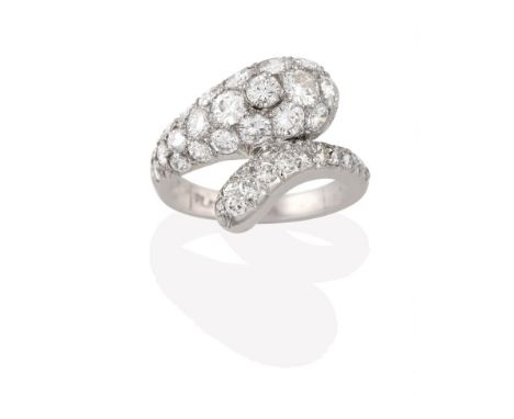 A Diamond Snake Ring, the snake head and tail set throughout with round brilliant cut diamonds in white pavé settings, to a p