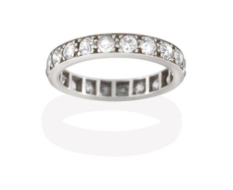 A Diamond Eternity Ring, the twenty old cut diamonds in white claw and channel settings, total estimated diamond weight 2.00 