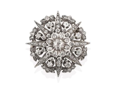 A Late 19th Century Diamond Brooch, of cluster star design, an old cut diamond centrally to a radiating border of rose cut an