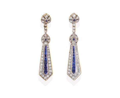 A Pair of 18 Carat Gold Sapphire and Diamond Drop Earrings, a kite shape formed of a line of calibré cut sapphires within a b