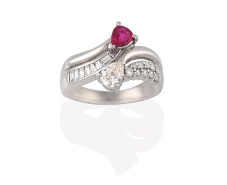 A Ruby and Diamond Ring, the parted shoulders set throughout with baguette cut and round brilliant cut diamonds terminating t