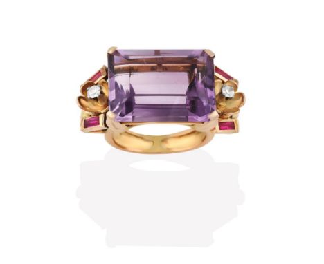 An Amethyst Ring, the emerald-cut amethyst in a yellow claw setting, flanked by foliate motifs with an eight-cut diamond cent