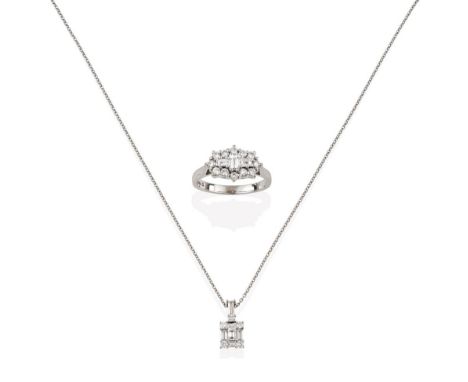 An 18 Carat White Gold Diamond Cluster Ring, three baguette cut diamonds centrally within a border of round brilliant cut dia