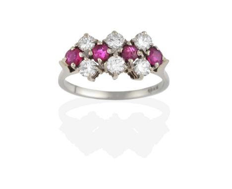 A Ruby and Diamond Cluster Ring, four round cut rubies spaced by three pairs of round brilliant cut diamonds, in white claw s