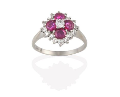 A Ruby and Diamond Cluster Ring, the central round brilliant cut diamond within a border of four round cut rubies, to a furth