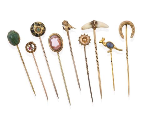 A Collection of Nine Stickpins, comprising of a cornelian cameo shield example; a scarab example; an insect example; a horses