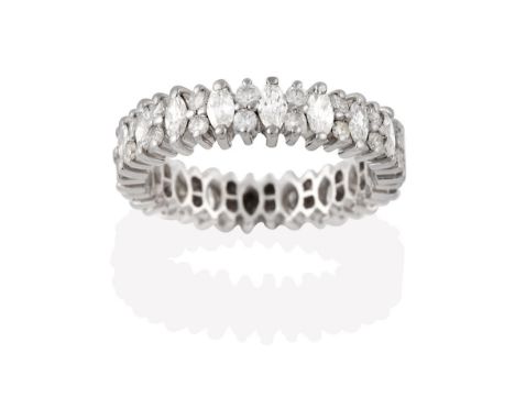 A Diamond Eternity Ring, the continuous band formed of marquise cut diamonds alternating with pairs of round brilliant cut di