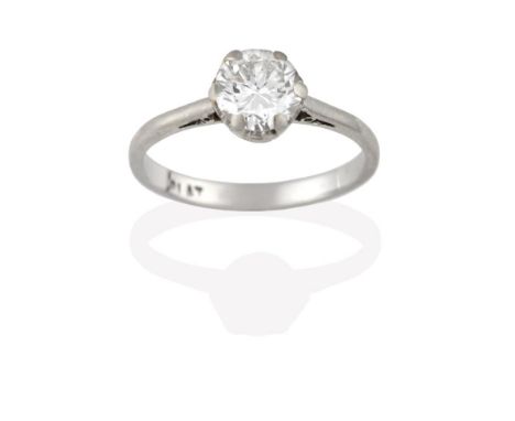 A Diamond Solitaire Ring, the old cut diamond in a white claw setting, to a tapered shoulder plain polished shank, estimated 