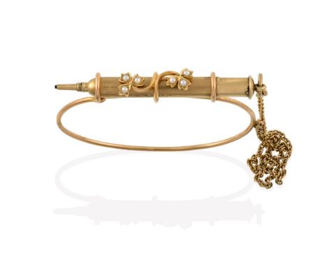 An Edwardian Split Pearl Propelling Pencil Bridge Bangle, the yellow bangle with three loops to the top to support the 9 cara