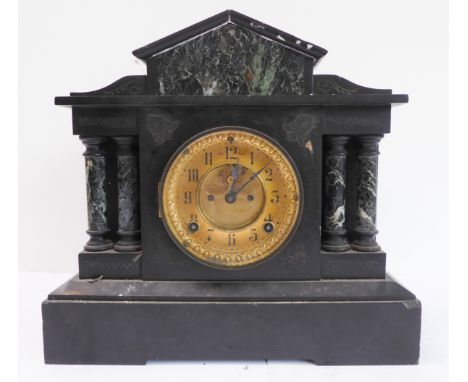 An Architectural-style, late 19th century black slate and marble eight day mantle clock: the gilded dial with Arabic numerals