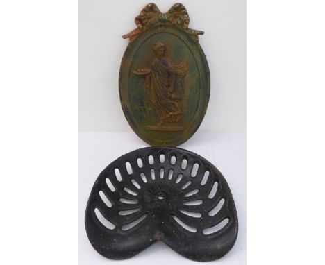 A cast-iron wall plaque with Abundantia-style relief (50 x 31.5 cm) and an early 20th century cast-iron Albion 5329 tractor s