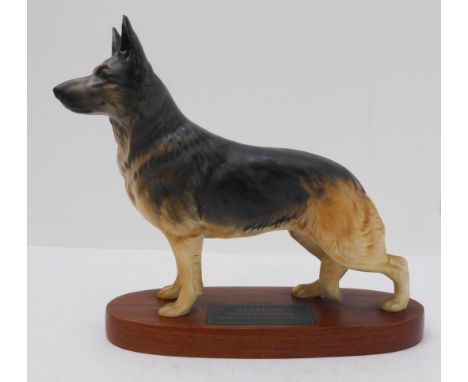 A Beswick porcelain model of a German Shepherd, on stand