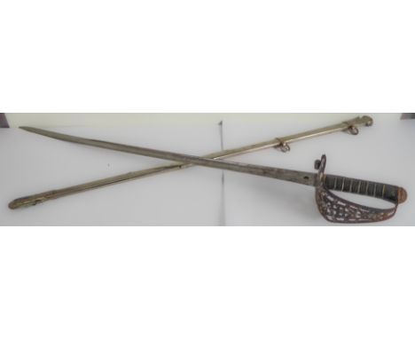 A Pattern 1897 cavalry officer's sword and scabbard: the 35" 'Patent Solid Hilt' blade numbered 39209 (1902) and etched with 