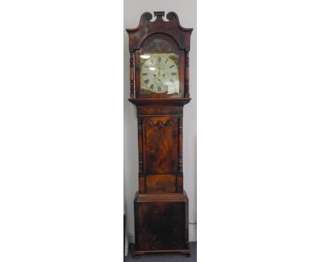 A large early 19th century figured mahogany and boxwood-strung eight-day longcase clock: the broken swan-neck pediment surmou