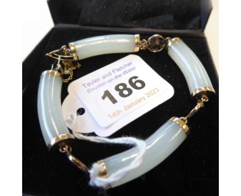 A 14-carat gold and jade bracelet