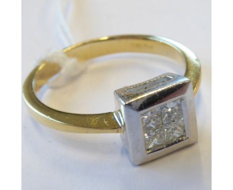 An 18-carat white gold ring, set with four princess-cut diamonds