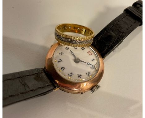 A 9ct gold cased wristwatch, manual wind movement, leather strap, 17.9g gross;  a yellow metal eternity ring, stamped 18ct, 3