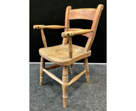 A Childs Elm and beech plug seat commode chair,  turned arms and legs, 63cm high. 