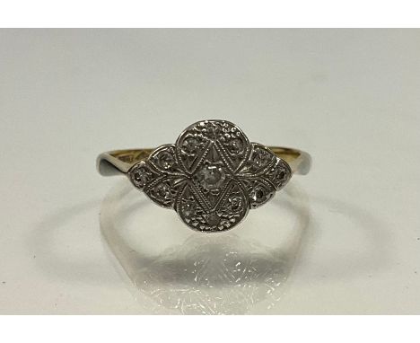 An Art Deco diamond cluster ring, quarter lobed crest set with thirteen round brilliant cut diamonds, total estimated diamond