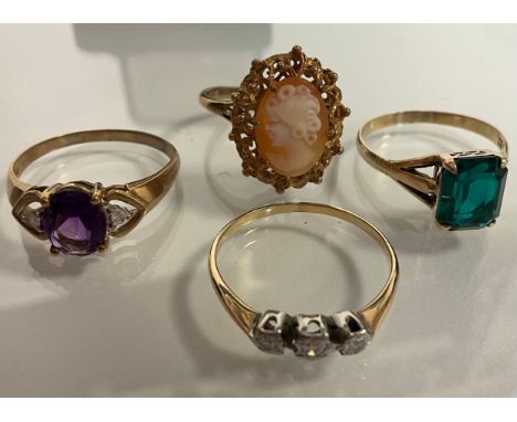 A 9ct gold cameo dress ring, 3.3g gross, Amethyst and diamond ring, 9ct mount, 2.39g gross,  diamond three stone ring, unmark