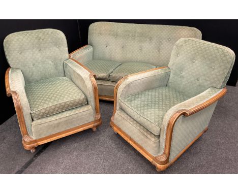 An early to mid century three seat sofa and pair of armchairs, carved walnut frames, the sofa measuring 82cm high x 182cm wid