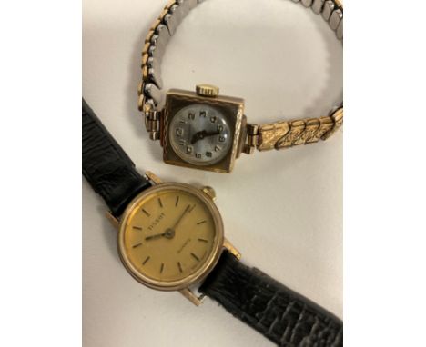 A ladys 9ct gold cased Tissot quartz wristwatch, leather strap, 12.7g gross, another smaller Excalibur manual wind, 9ct gold 