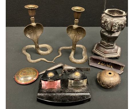 A Japanese bronze censer or incense burner, hexagonal forn cast with traditional figures and motifs;  a pair of Cobra candles