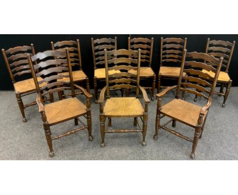 A set of nine ladder-back elm and stained beech chairs, comprised of six chairs, and three carver chairs, woven rush seating,