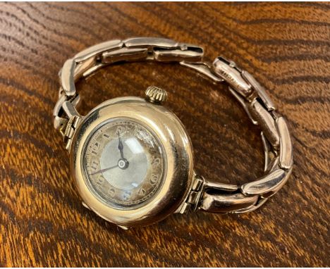 Rolex - a vintage 9ct gold cased wristwatch, 26mm diameter case, silvered dial, black Arabic numerals, spade hands, 15 jewel 