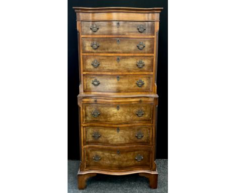 A George III revival walnut cross-banded mahogany chest on chest, of small proportions. Serpentine-shaped front, with out-swe