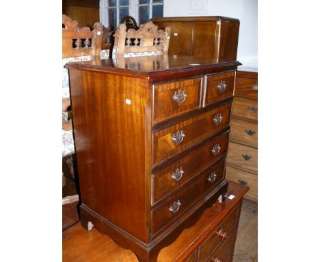 A good quality reproduction mahogany chest of two short over two long drawers, raised on bracket feet 