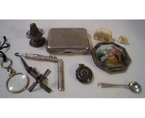 A Dutch white metal miniature model of a windmill, an early 20th Century continental white metal mounted and porcelain buckle