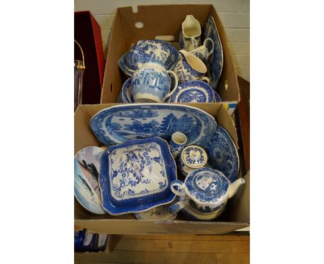Two boxes of 19th century and later blue and white ceramics to include a pearl ware jug, decorated with a figure on camel bac