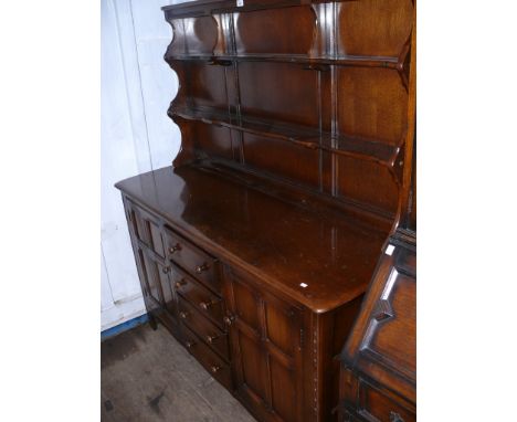 A 20th Century Ercol style dark oak Welsh dresser.