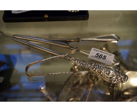 A mixed group of items to include a pair of silver handled glove stretchers, silver handled button hook and a pair of silver 