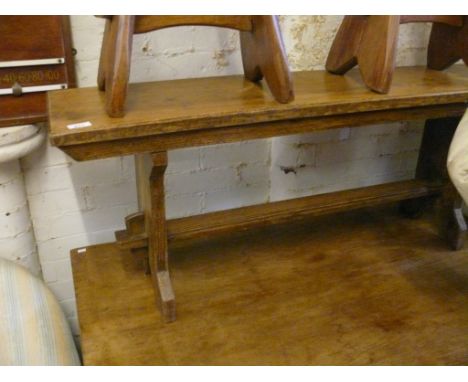 A good pine plank bench, raised on lyre supports 
