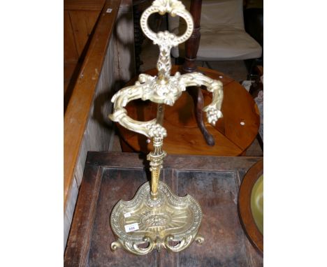 A reproduction brass twin division stick stand 