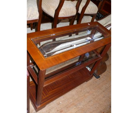 A reproduction inlaid mahogany console table with glass top 